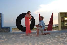 Proposal on the beach at sunset